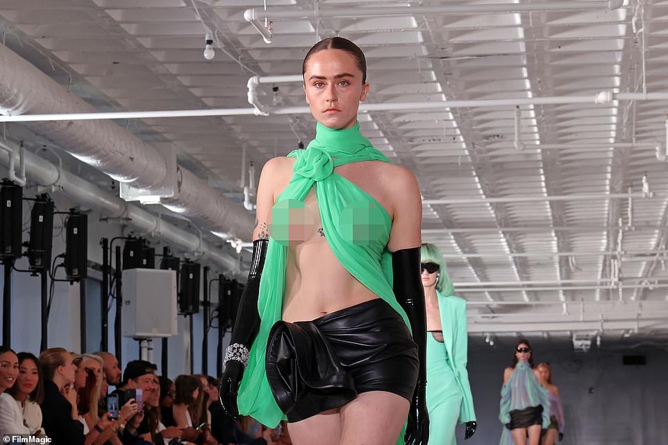 Kamala’s stepdaughter bares breasts as she walks NYC runway